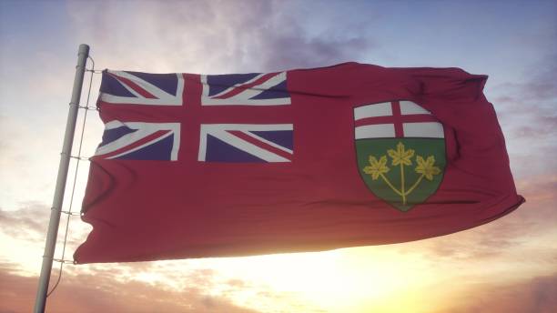 istock Ontario flag, Canada, waving in the wind, sky and sun background. 3d rendering 1346068973