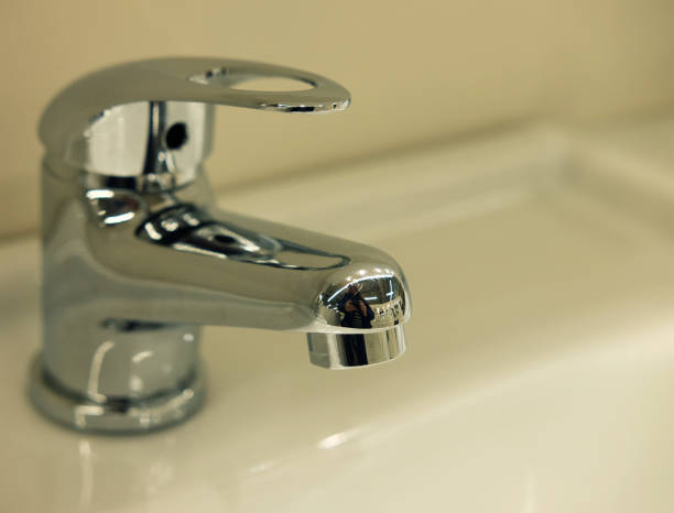 istock Modern bathroom faucet 1346069225