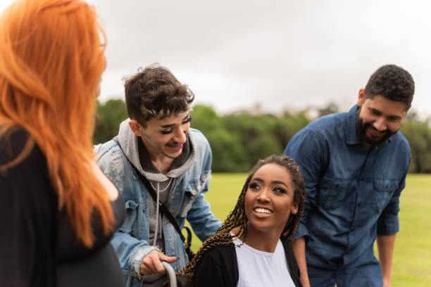 istock Group of friends having fun in the park. 1346070066