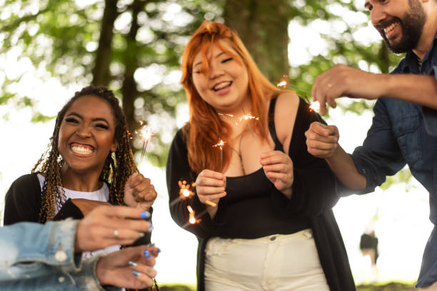 istock Group of friends having fun in the park. 1346070691