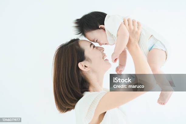 Mom Holding The Baby High Stock Photo - Download Image Now - Baby - Human Age, Mother, Offspring