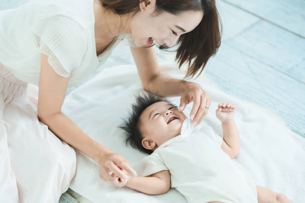 istock Mom and baby playing indoors 1346072922