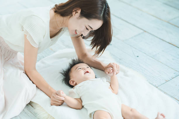 istock Mom and baby playing indoors 1346073586