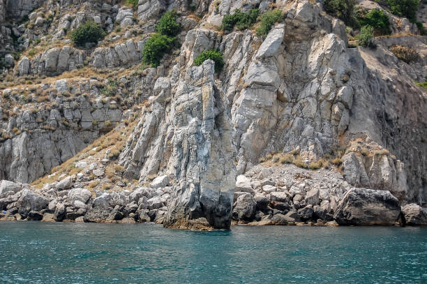 istock rocks over the seaside landscape 1346073605