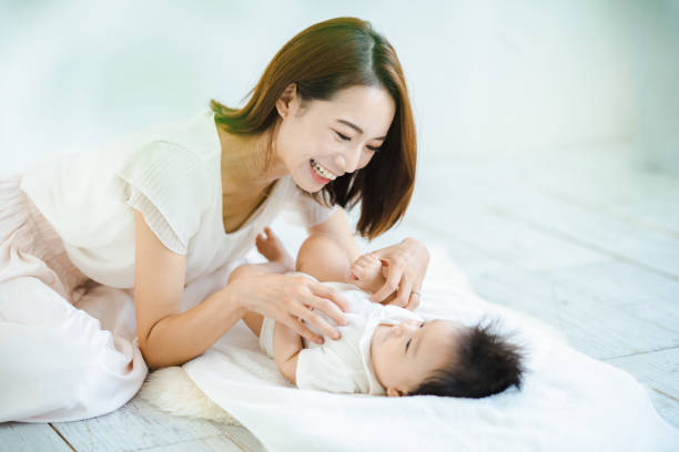 istock Mom and baby playing indoors 1346073677