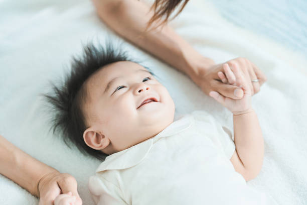 istock Mom and baby playing indoors 1346073837