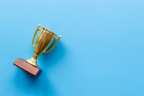 istock Champion award - golden trophy cup for winner, top view 1346074564