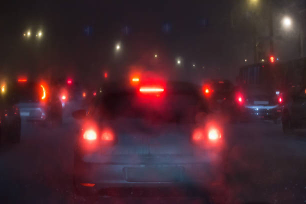 istock Night traffic on a winter road 1346075276