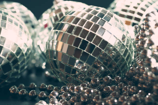 istock Mirror balls reflecting lights close up, nightlife background 1346078957