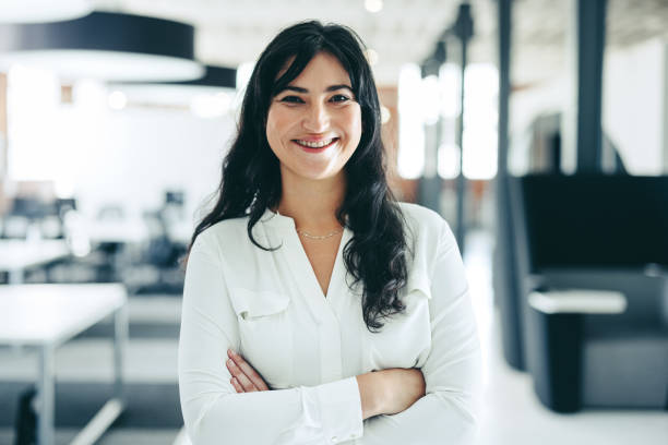 istock Successful businesswoman smiling at the camera 1346079771