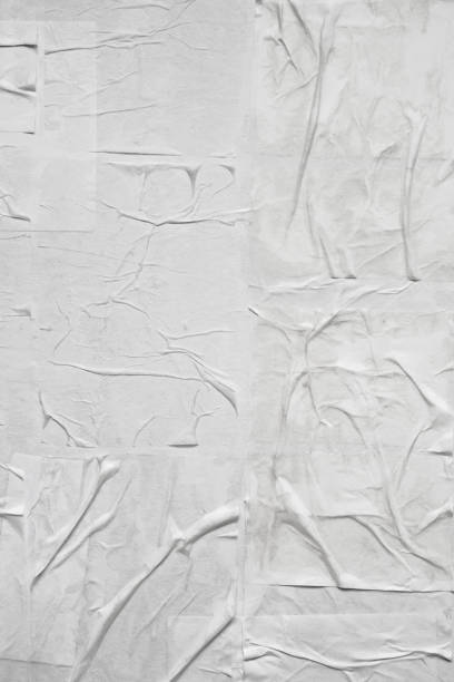 istock Blank white crumpled and creased paper poster texture 1346080623