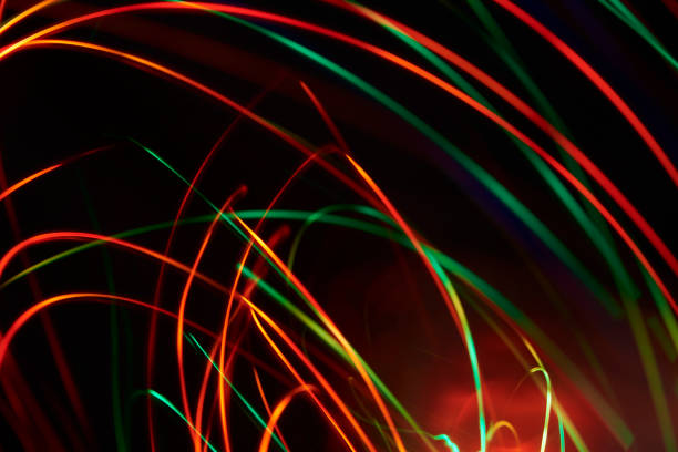 istock Abstract christmas red and green light lines background 1346081847