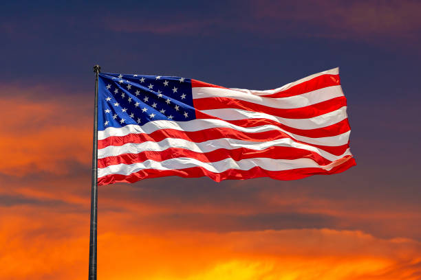 istock USA flag waving against sunset sky 1346081886