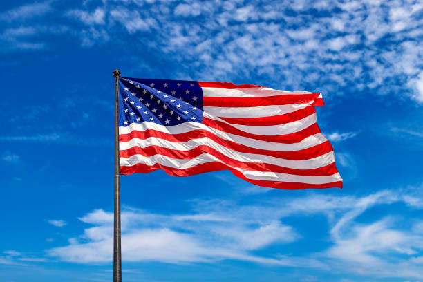 istock USA flag waving against sky 1346082005