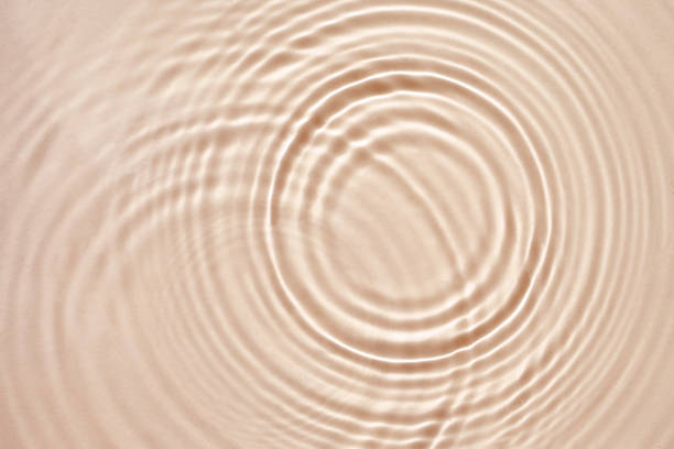 istock Beige cream texture with beautiful circles and ripples, abstract background for cosmetics 1346088741