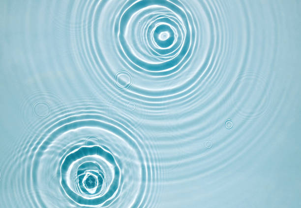 istock Blue water texture, blue mint water surface with rings and ripples. Spa concept background. Flat lay, copy space. 1346088749