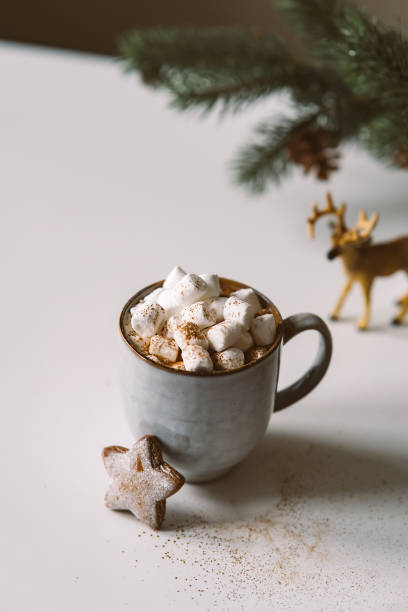 istock Hot cocoa with marshmallows in a Christmas atmosphere with gingerbread 1346088846