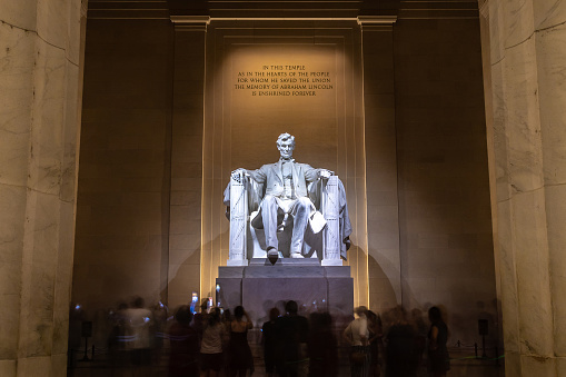 Detail of the marble statue of Abraham Lincoln within the Lincoln Memorial National Monument in Washington DC.