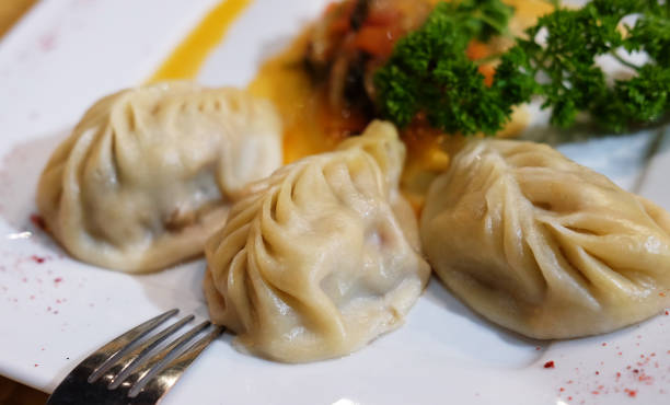 Dumplings, Manti - traditional meat dish of Central Asia Dumplings, Manti - traditional meat dish of Central Asia, close up russian pelmeni stock pictures, royalty-free photos & images