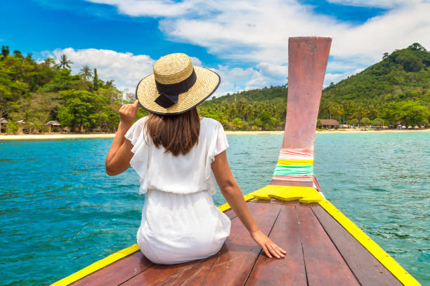istock Woman on boat in Thailand 1346091693