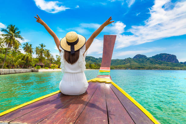 istock Woman on boat in Thailand 1346091706