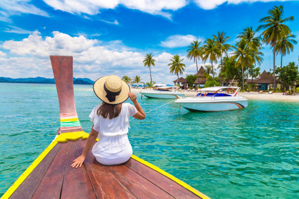 istock Woman on boat in Thailand 1346091721
