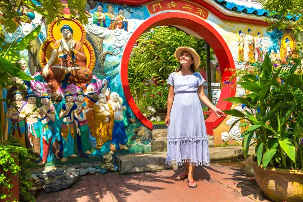 Woman traveler at  Kek Lok Si Temple in Georgetown, Penang island, Malaysia