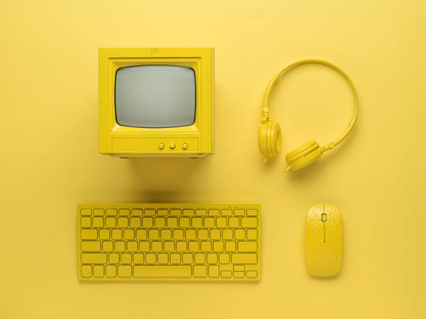 istock Personal computer with accessories in yellow style on a yellow background. Flat lay. 1346094835