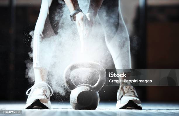 Cropped Shot Of An Unrecognizable Woman Lifting A Kettlebell At The Gym Stock Photo - Download Image Now