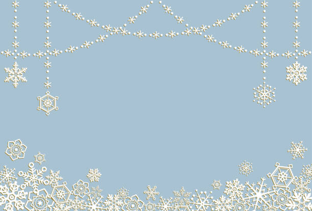 istock A message card with white and gold snowflakes on a blue gray background. 1346095793
