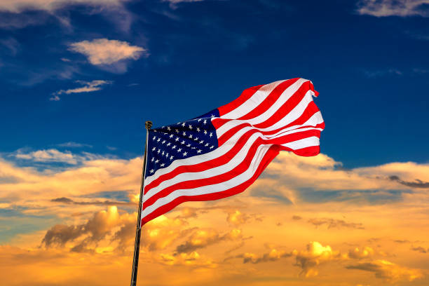 istock USA flag waving against sunset sky 1346096732