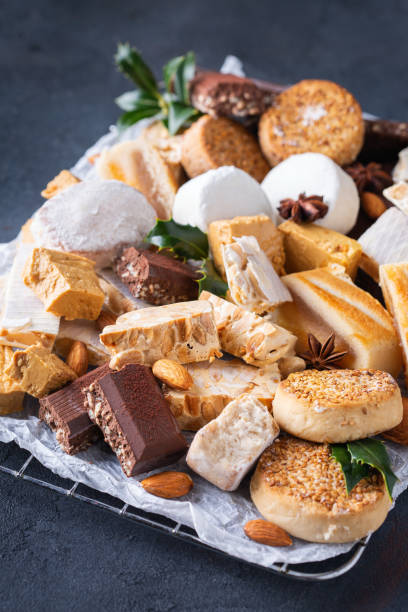 istock Typical Spanish Christmas sweets, shortbread mantecados, polvorones, nougat or turron 1346098392
