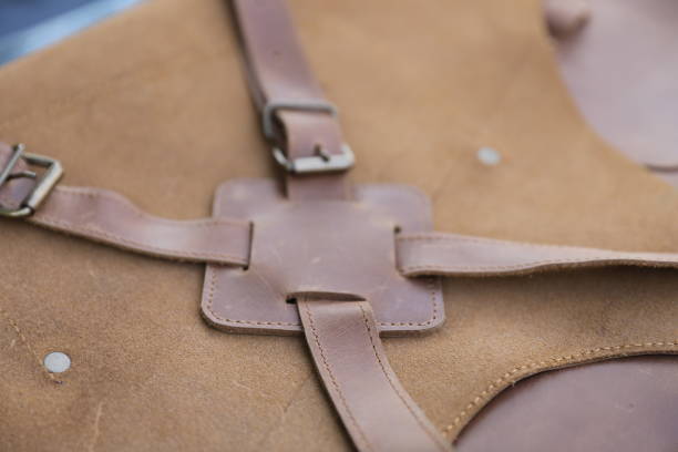 istock Brown Leather Aprons.  Cross back Leather Working Apron. Welding Leather Apron. Close-up  Brown  Leather Apron. 1346099178