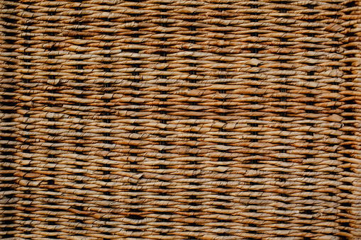 Close up of weaven ratan texture. Straw basket detail