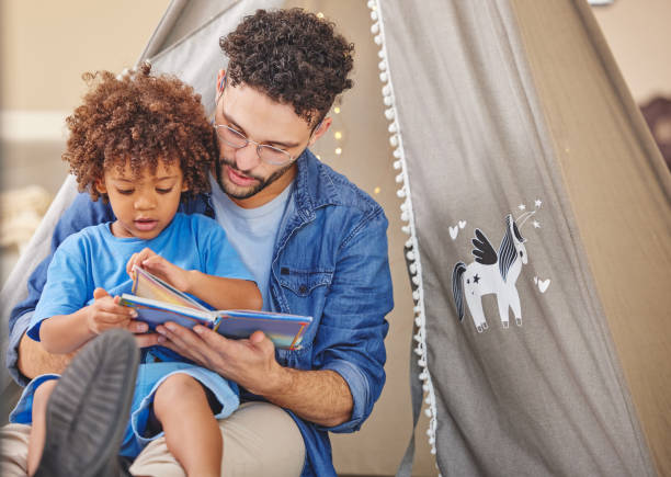 istock Shot of a father reading to his son 1346101746