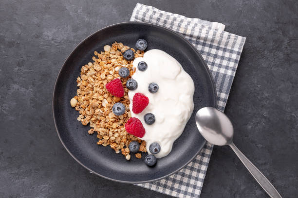 istock Healthy breakfast with baked granola and greek yogurt. Assorted fresh berries 1346101949