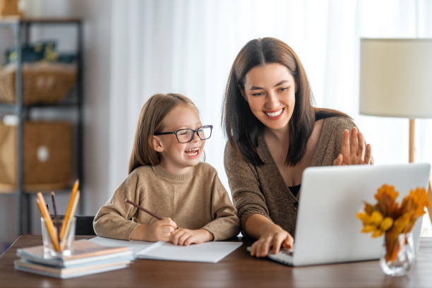 istock Girl doing homework or online education. 1346101958