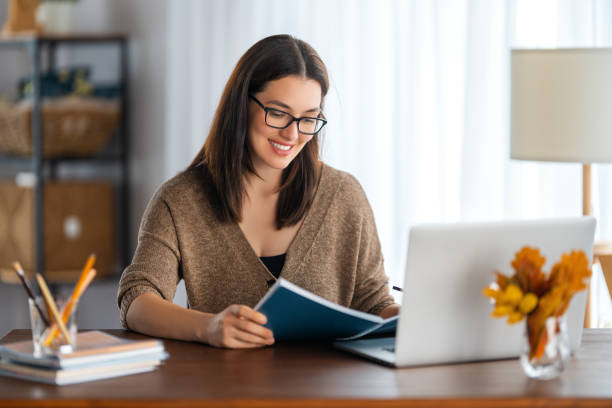 istock young woman working at home 1346102658