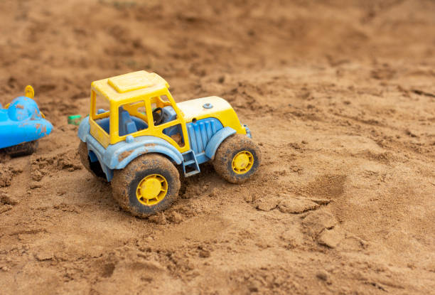 Children's small toy truck in the sand