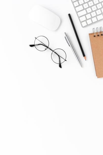 istock Elegant workspace with financial accessories isolated on white background with copyspace. Office desktop 1346108535
