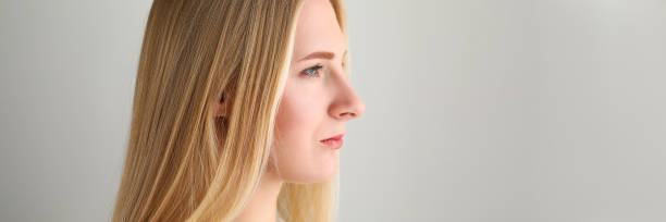 istock Attractive female wearing white sweater 1346109230
