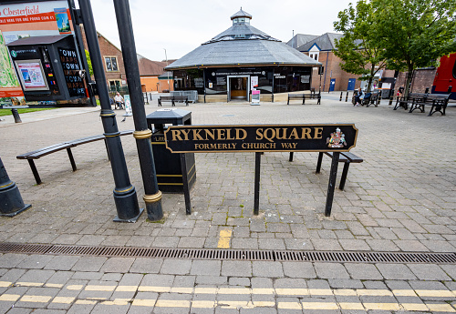 Rykneld Square in Chesterfield, England, with commercial slogans and people visible