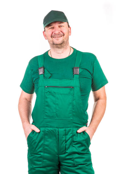 istock A worker in a green overalls looks ahead. 1346109512
