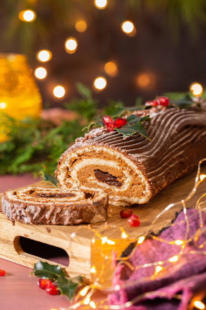 istock Traditional Christmas cake, chocolate Yule log with festive decorations 1346110296
