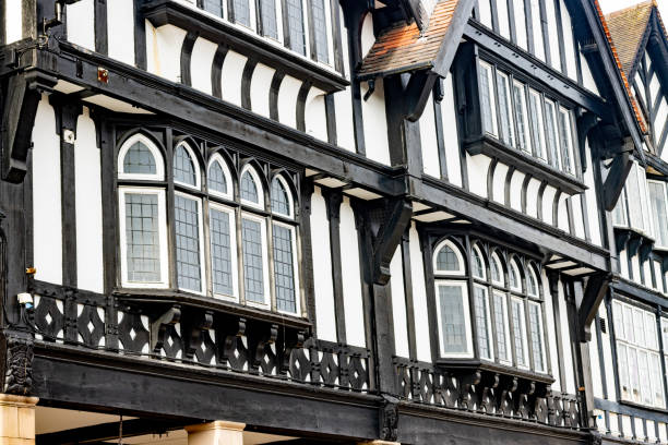 Ornate wooden carving on the exterior of Paycockes House in the town of Coggeshall in Essex, UK.  It is a surviving example of a Tudor merchants house.