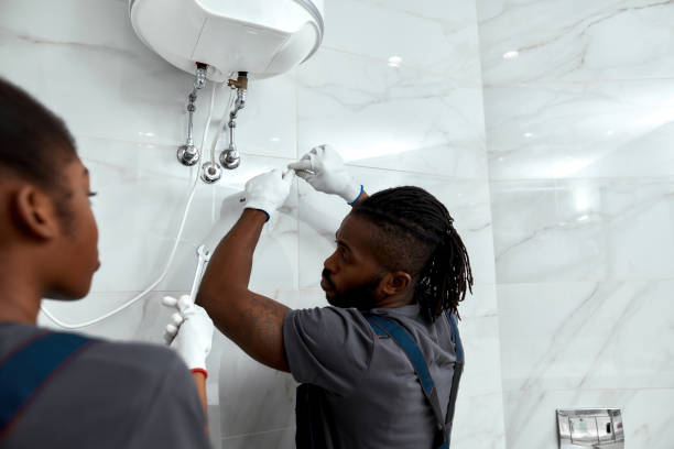 istock Young mechanic inspecting electrical boiler at home 1346110413