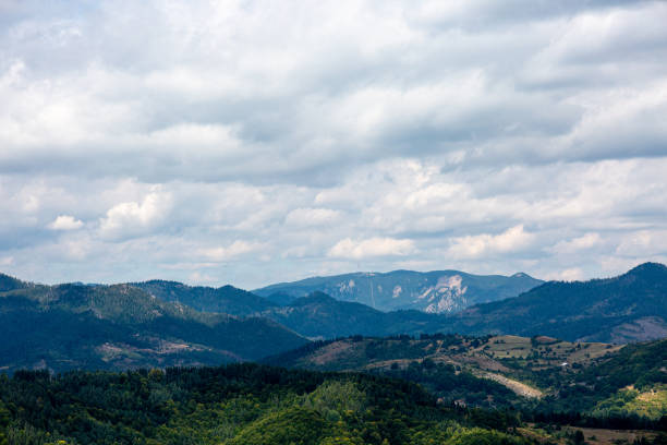 istock View to mountain and forest with cloudy sky 1346111483