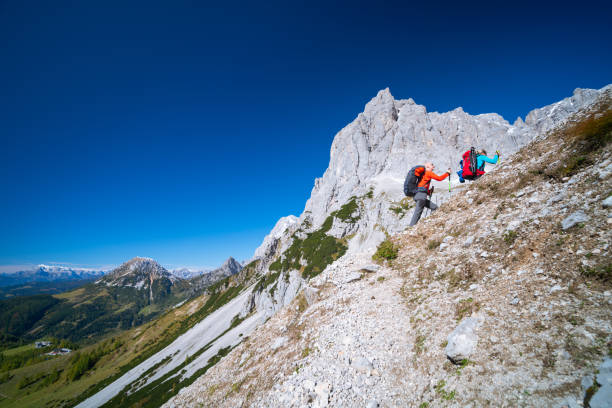 istock Couple Hiking in Dachstein Mountains in Austria 1346112708