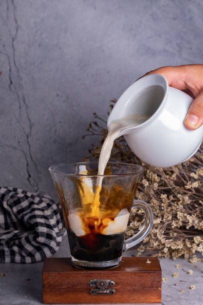 istock Fresh milk brown sugar in clear glass gray background 1346116404