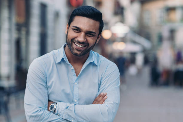 istock Cheerful Middle-Eastern ethnicity man standing on the street 1346116436